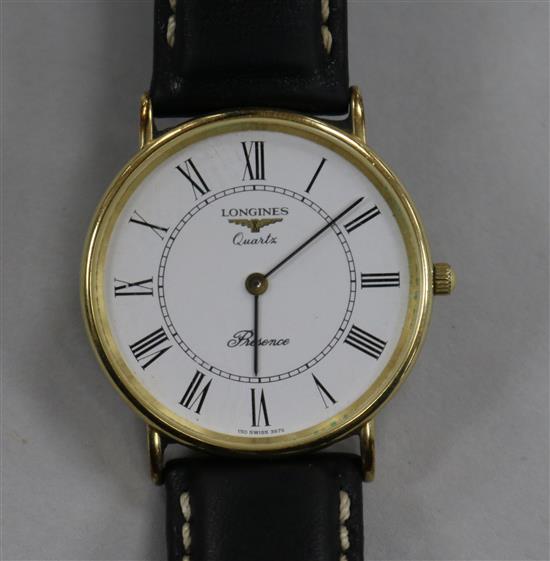 A gentlemans 9ct gold Longines Presence quartz wrist watch.